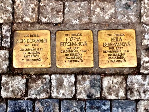 Commemorative street plaques of  Prague's Jewish Holocaust victims at their former residence - a father, mother and child