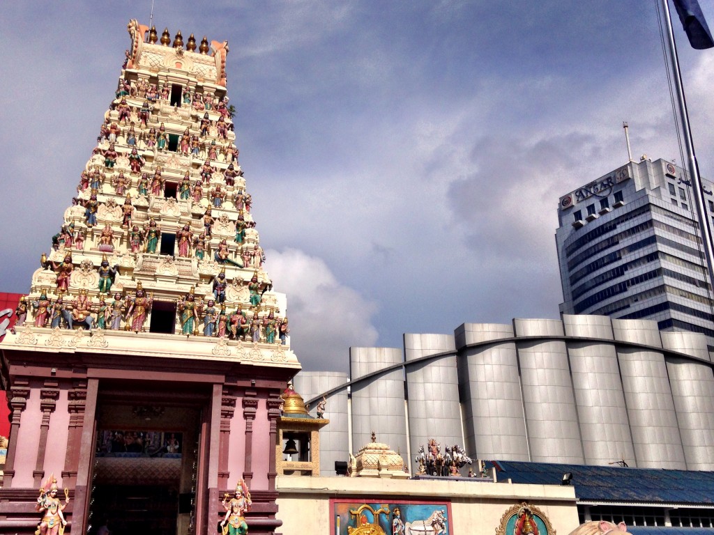 Hindu temple juxtaposed with modern shopping center