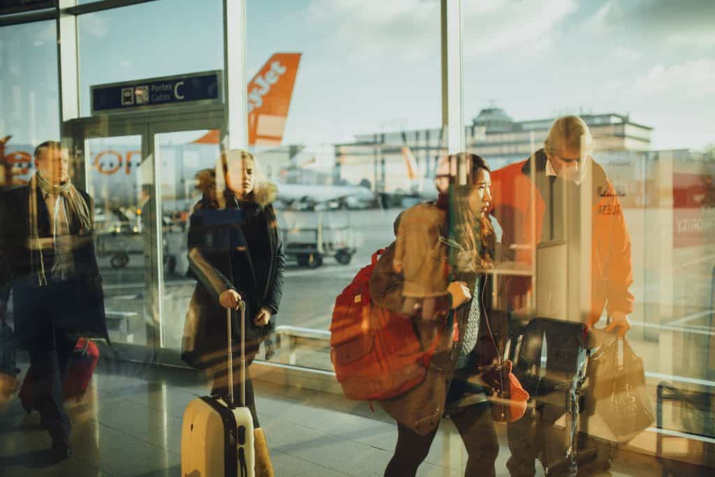 air travelers at airport gate
