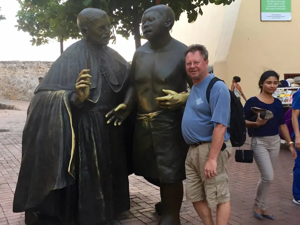 cartagena colombia tours - statue of san pedro claver and a slave