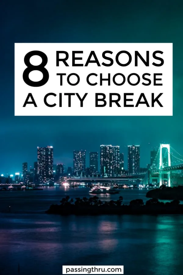 city skyline at night from the water 8 reasons to choose a city break