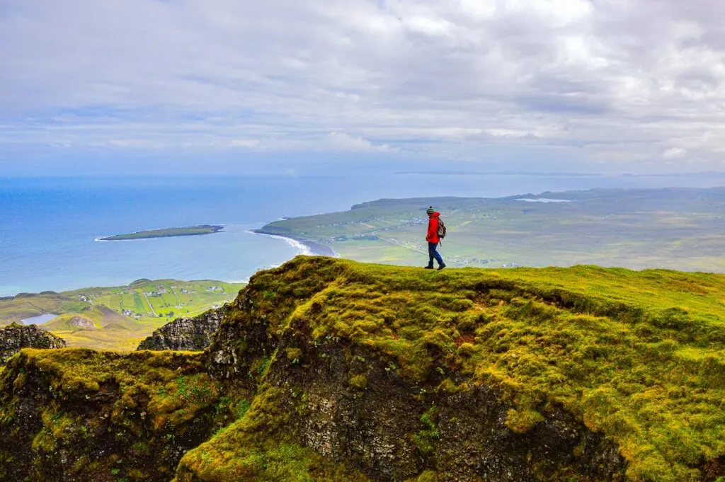 man hiking scottish highlands