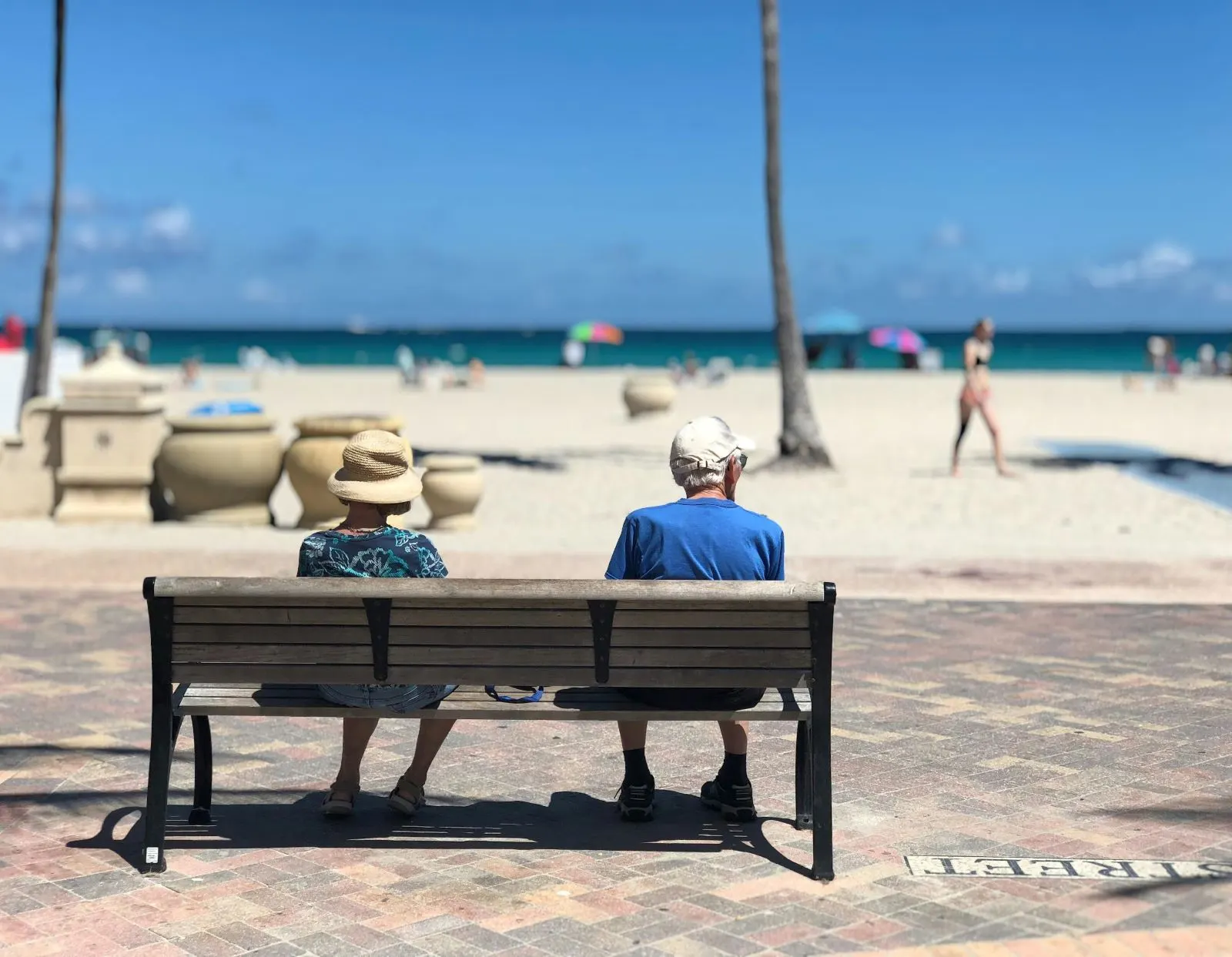 The Best Places in the World to Retire 1 Two older adults sitting on a bench facing the ocean
